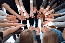 Background Image Of A Group Of People Joining Their Hands In A Circle