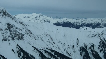 Wall Mural - 4k aerial of the coast mountains in late winter, garibaldi provincial park, british columbia, canada