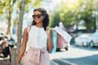 © Nola Viglietti/peopleimages.com - Adding items to my closet. Shot of an attractive young woman going shopping in the city.