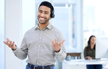 We Dont Like To Brag, But We Are The Best. Portrait Of A Young Businessman Using A Headset In A Modern Office.
