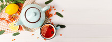 Composition With Tasty Rowan Tea On Light Wooden Background With Space For Text