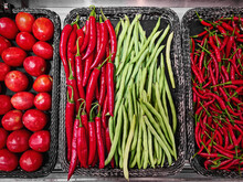 High Angle View Of Spicy Red And Green Chilies In Baskets