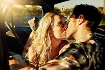 This road trip made us connect deeply with one another. Shot of an affectionate couple kissing in a pickup truck.