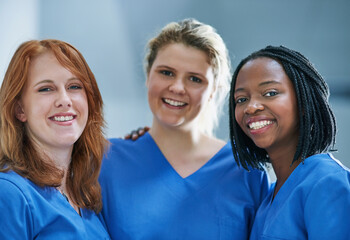 Canvas Print - Three times the surgical skill. Portrait of a team of confident young surgeons working in a hospital.