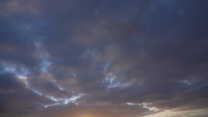 Wall Mural - beautiful early morning colorful sunny sunrise blue sky with fluffy purple and white clouds flying o