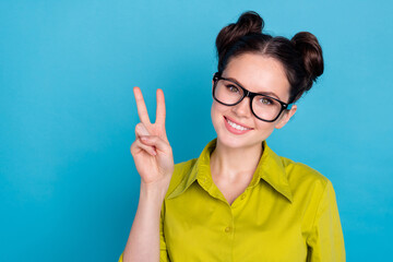 Poster - Portrait of optimistic real estate ceo agent lady make v sign symbol isolated on blue color background