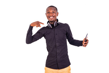 Poster - portrait of a handsome student pointing at headphone smiling.