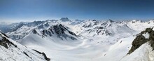 Ski Tour In The Beautiful Swiss Alps In Davos Klosters Mountains. Ski Mountaineering On Snowy Mountain Peaks. View To Piz Kesch On Sertigpass