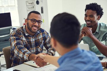 Poster - I look forward to seeing the fresh perspective youll bring. Cropped shot of designers shaking hands during a meeting in an office.