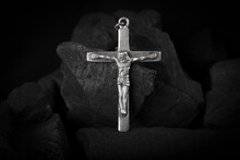 Silver Crucifix Necklace Cross On Pieces Of Coal.