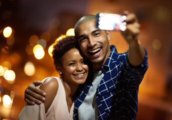 Poster - I want to remember this moment forever. Cropped shot of an affectionate young couple taking selfies while out on a date in the city.