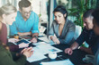 © Adene Sanchez/peopleimages.com - Going over the paperwork. High angle shot of a group of businesspeople meeting in the boardroom.