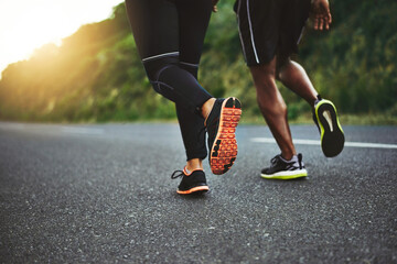 Poster - Dont expect change if you dont make it. Low angle shot of an unrecognizable couple out running together.