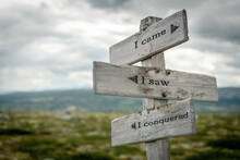 I Came I Saw I Conquered Text Quote Written In Wooden Signpost Outdoors In Nature. Moody Theme Feeling.