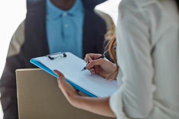 Poster - Marking her delivery as received. Cropped shot of a businesswoman signing for a package delivered by a courier to her office.