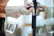 © C Coetzee/peopleimages.com - Everyone touches the handles. Shot of an unrecognizable person cleaning a door handle at home.