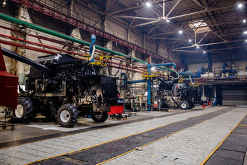 Wall Mural - Process of assembling of agricultural tractors or combine harvesters in workshop