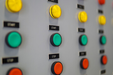 Wall Mural - Electrical selector switch,button switch,Electrical switch gear at Low Voltage motor control center cabinet in coal power plant. blurred for background.