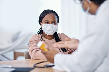 Aufkleber - Listening to the doctors instructions. Shot of a young woman receiving medication from a doctor during a consultation.