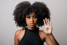 Black Woman Makes Gesture With Open Hand, Denounces Assault, Moral Harassment, Cowardice, Violence Against Women, Isolated On Gray Background