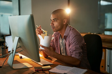 Aufkleber - Success is the order of the day and night. Cropped shot of a young designer eating takeaways while working late in an office.