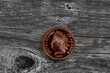 Single US Indian head one cent coin on rustic wood for numismatic investment collecting