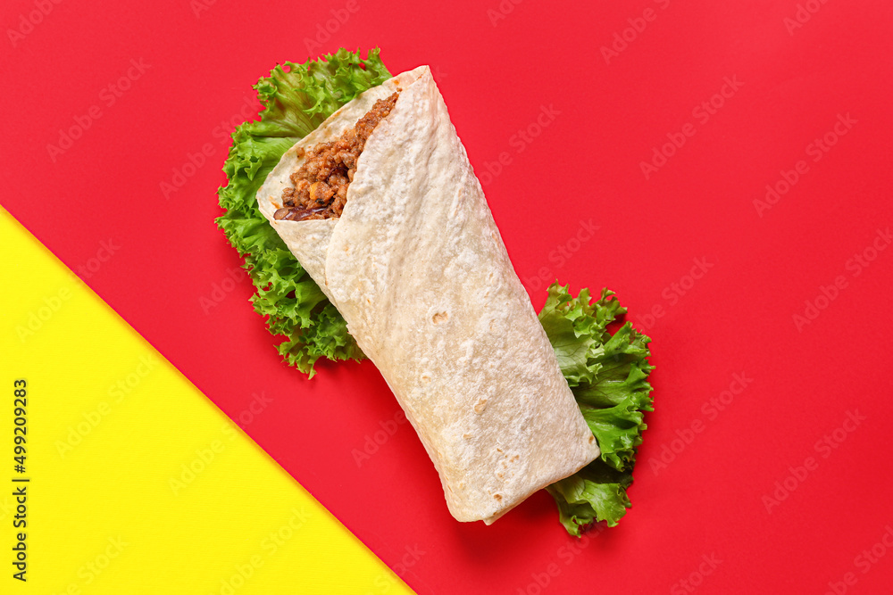 Tasty burrito on color background
