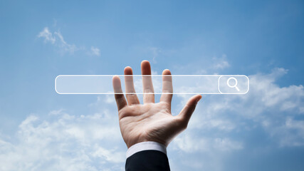 Wall Mural - internet search data browsing data with search bar, man holding search bar on sky and clouds backgro