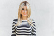 © T.Den_Team - 60s-70s look. Woman blonde hair vintage makeup wear striped jumper, fashionable concept