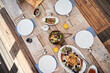 Special meals that bring people together. High angle shot of a table setting with food and drinks outdoors.