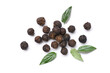 Flat lay of black peppercorns (black pepper) with leaves isolated on white background.
