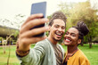 © T Chithambo/peopleimages.com - Selfies in the park with my sweetheart. Cropped shot of a young beautiful couple spending the day in a public park.