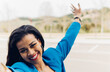 © Dani D.G - Joyful black woman with raised arms