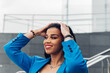 © Dani D.G - Cheerful black woman touching hair