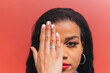 © Dani D.G - Black woman covering eye with hand