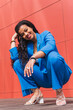 © Dani D.G - Cheerful black woman in stylish outfit