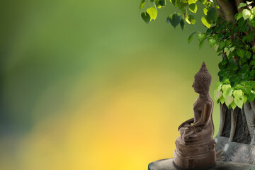 Wall Mural - Buddha statue sitting on bokeh nature background with clipping path. Vesak day,asanha bucha day,makha bucha concept.