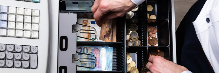 Euro Banknotes And Coins In Cash Box