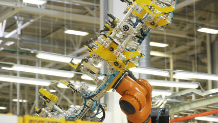 Wall Mural - New technologies and machines in production. Scene. Robotic equipment in production of auto parts. Latest technologies in production of spare parts and machines
