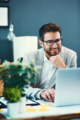 Aufkleber - Its been a successful day so far. Portrait of a young businessman working on a laptop in an office.