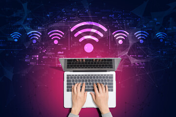 Wall Mural - Wifi theme with person using a laptop computer