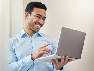 Sticker - So many emails to be sent. Shot of a young businessman using his laptop in his office.