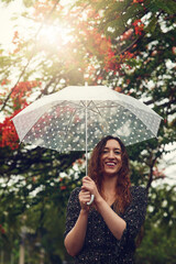 Aufkleber - Some people look at rain and frown, not her. Cropped shot of a beautiful young woman walking in the rain outside.