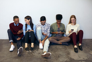 Aufkleber - Catching up on our social networking. Shot of university students social networking in a campus corridor.