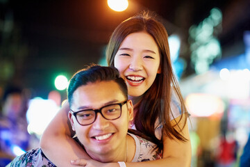 Were having so much fun in the city. Shot of a happy young couple spending the night out in the city.