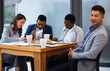 © Nina L/peopleimages.com - Its important that team members hear out one anothers opinions. Shot of a group of colleagues having a meeting and breakfast in a modern office.
