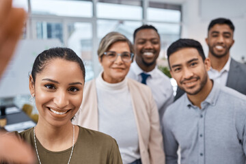 Wall Mural - the best team to be a part of. portrait of a group of businesspeople taking selfies together in an o