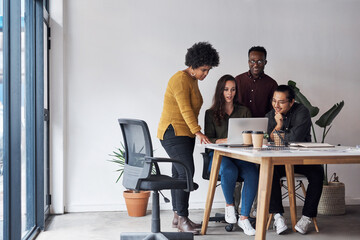 Poster - We are such a strong team when we come together. Full length shot of a diverse group of businesspeople working on a laptop together in a modern office.