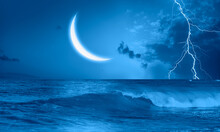 Night Sky With Blue Crescent Moon In The Clouds On The Fore Ground Strong Sea Wave 