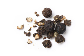 Flat lay of cracked black peppercorns (black pepper) isolated on white background.